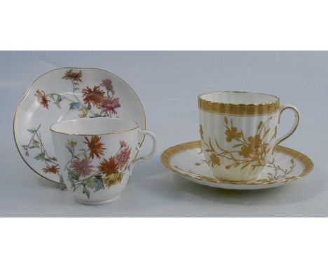 A Royal Worcester cup and saucer, decorated with flowers, together with another cup and saucer, the fluted body decorated wit
