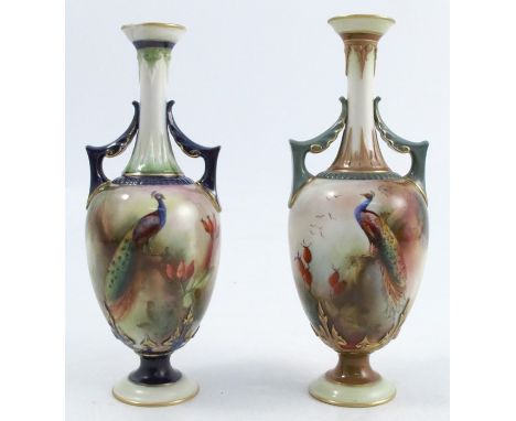 Two Royal Worcester pedestal vases, both decorated with peacocks in branches, one signed J Southall, shape umber H211, dated 