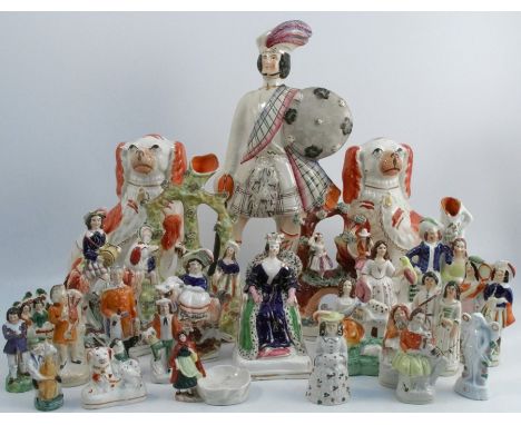 A collection of 19th century Staffordshire figures, to include a pair of seated spaniels, a named model of Wallace, a Queen s