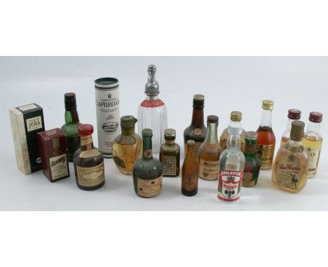 A collection of miniature spirit bottles, to include Dimple Scotch Whisky, Bells, Cointreau, Laphroaig, Red Hackle, Guinness,