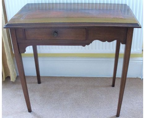 A mahogany side table, the top with inset tooled leather panel, fitted with a drawer to the frieze, raised on square tapering