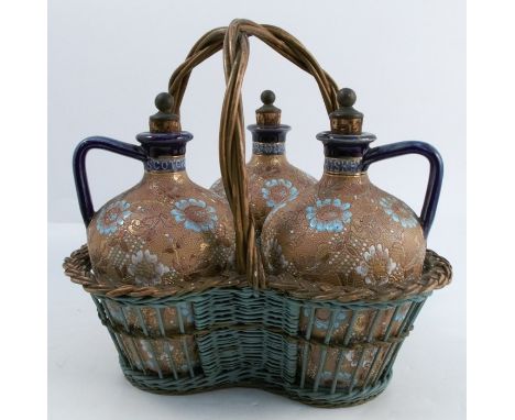 A set of three Doulton &amp; Slaters stoneware decanter bottles, marked Irish Whiskey, Scotch Whiskey and Brandy, the body de