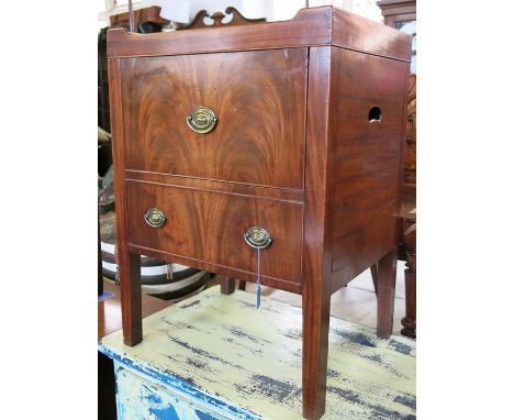 A 19th century mahogany tray top commode, the hinged top revealing a chamber pot, fitted with a dummy drawer and raised on sq