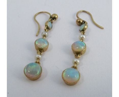 A pair of opal and seed pearl drop earrings, the three graduated round cabochons with a seed pearl between each, 2.7cm long