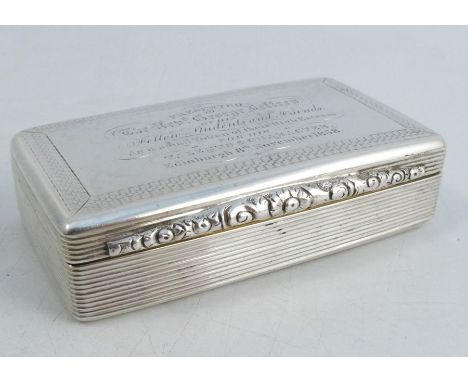 A 19th century silver snuff box, of rectangular form, with engraved presentation inscription to the top, having a floral open