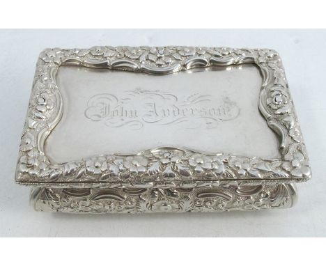 A 19th century silver table snuff box, of rectangular form, with raised floral border, the top engraved John Anderson with sc