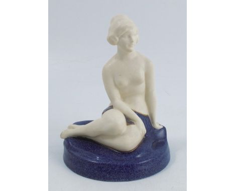A Royal Worcester Crown Ware figure, of a seated semi naked female, decorated in parian with a mottled blue ground, shape num