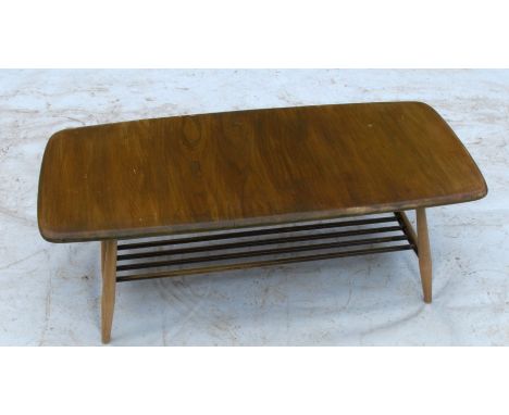 An Ercol rectangular coffee table, with magazine shelf under, 41ins x 18.5ins x 14ins