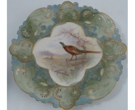 A Grainger's Worcester plate, decorated to the centre with a pheasant in landscape possibly by Stinton, to an embossed border