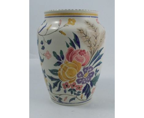 A Poole Pottery vase, decorated with flowers to a white ground, numbered 213, height 9.25ins