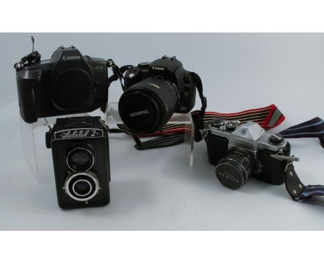 A collection of cameras and equipment, to include a Canon EOS600 camera, a Canon ESO350D Digital, a Lubitel 2 camera, an Asah