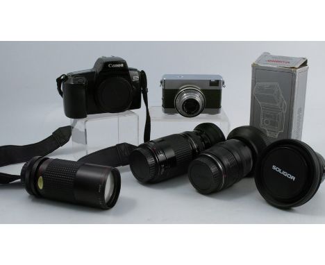 A collection of cameras and equipment, to include a Zeiss Warra in olive, a Canon zoom lens EF 35-105mm, a Canon zoom lens EF