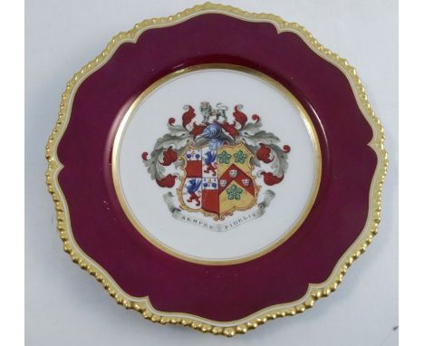 A Flight, Barr &amp; Barr Worcester plate, the centre decorated with an Armorial, to a burgundy border and shaped gilt edge, 