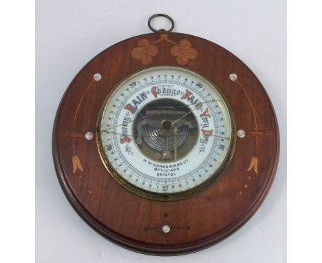 An M.W. Dunscombe Ltd Bristol barometer, set in a mahogany frame with inlaid mother of pearl and satinwood, glass af, overall
