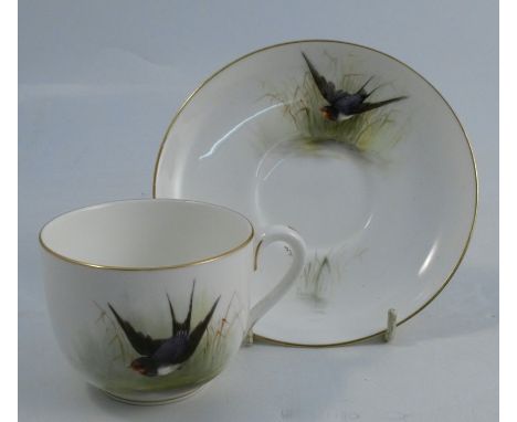 A Royal Worcester cup and saucer, decorated with swallows by W Powell, inscribed to underside, dated 1918Condition Report:  O
