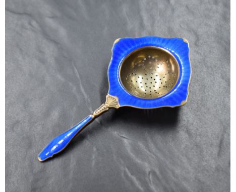 A 20th century Norwegian sterling tea strainer, having blue guilloche enamel, marks for Kristian M. Hestenes, Bergen, 39g gro