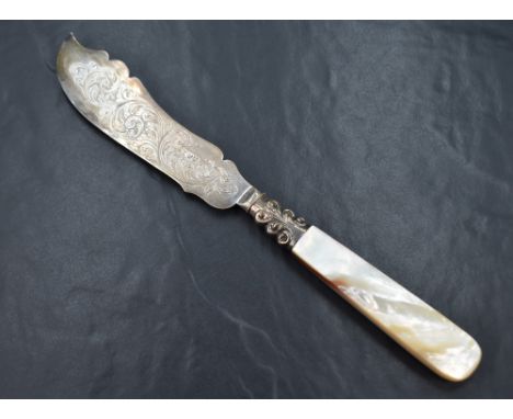 A cased Victorian silver wedding cake knife, having decorative scroll engraving to the silver blade with an ornate embossed s
