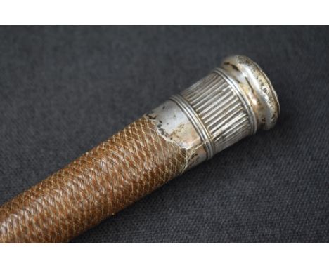A white metal mounted riding crop, the woven body with a rounded top, engraved 'Tho Hodgson 1771 Dacre', unmarked, 81cm