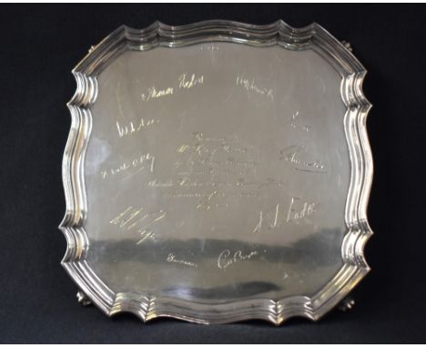 An Elizabeth II silver presentation salver, having Chippendale inspired rim with engraving 'Presented to Mr Percy Webster by 