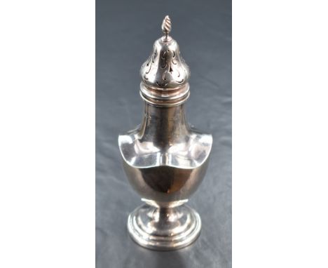 A George V silver sugar caster, of traditional baluster form having a spiral finial and quatrefoil lobed body, raised on a ci