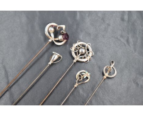 A group of five Charles Horner silver hat pins of various design, sold along with the base of a silver hat pin stand of circu