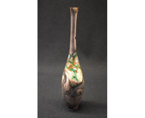 A Japanese Meiji period white metal vase, of tapered bulbous form, having ornate three-toed dragons to the body with some rem