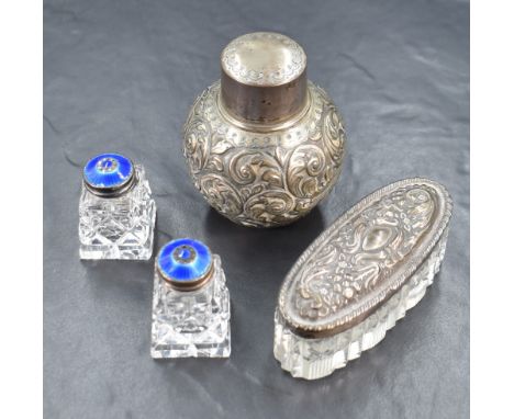 A pair of Norwegian silver mounted cut glass scent bottles, the silver tops having blue guilloche enamel, sold along with a s