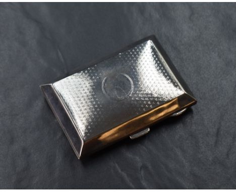 A George V silver cigarette case of hinged rectangular form slightly curved for the gentleman's pocket, having engine turned 