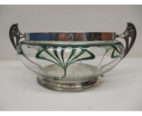 A WMF silver plated and clear glass salad bowl with twin handles, decorated with flowers and the bowl with green styalized fl