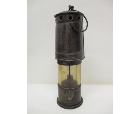 A steel miners drift lamp with a clear glass panel, 9" h 