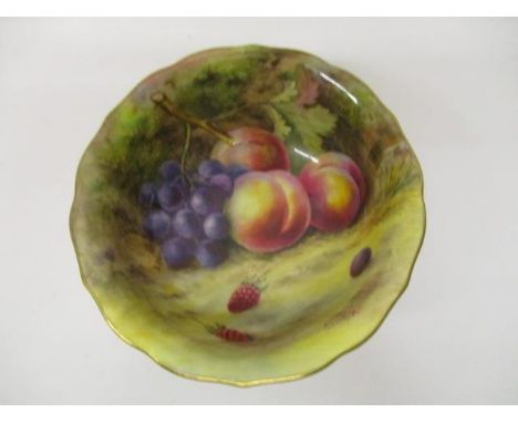 A Royal Worcester china bowl decorated with peaches, grapes and raspberries, signed T Lockyer, factory mark and inscribed 'Go
