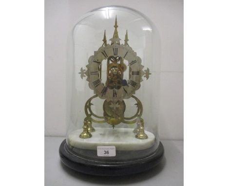 A 19th century brass skeleton clock having a silvered dial with Roman numerals and an 8 day fusee movement, mounted on a circ