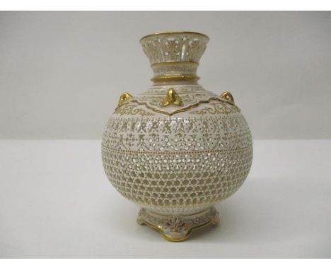 A Royal Worcester reticulated, cream glazed china vase by George Owen, of bulbous form with a flared neck, four handles and h