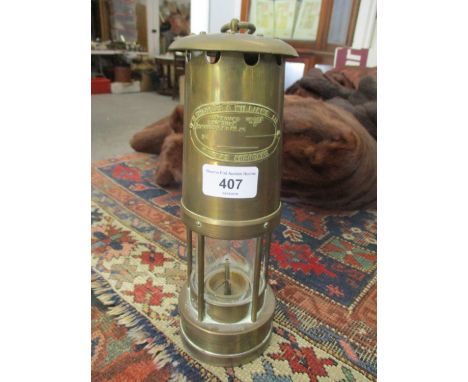 An E Thomas & Williams brass cased miners safety lamp 