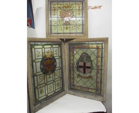 Three 19th century stained glass windows, one with an Armorial shield and ribbons in green, red and yellow, 31 1/2" x 21 1/2"