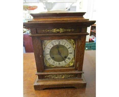 A Victorian oak cased bracket clock with brass mount, gilt metal dial with Roman chapter ring, inscribed George Pearce 38 Lon
