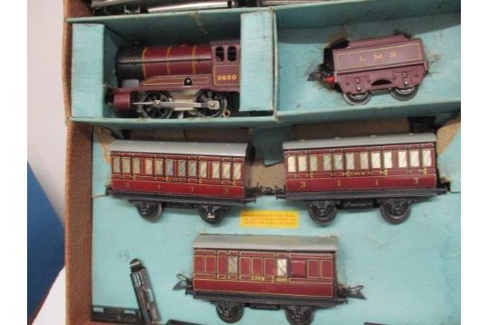 A Hornby 0 gauge clockwork model passenger train set, comprising a 0-4 ...