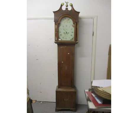 A George III oak cased 8 day long case clock, the arched top painted dial having Roman numerals, subsidiary seconds dial and 