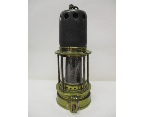 A Patterson 'Donald' steel and brass miners safety lamp with a gauze within a glass panel, 8 1/2" h 