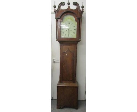 A George III  mahogany an oak cased 8 day long case clock. The arched top painted dial inscribed Saltby, Grantham and having 