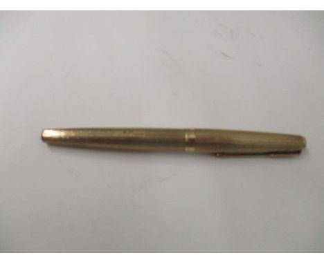 A 9ct gold cased Parker 61 pen with engine turned decoration 