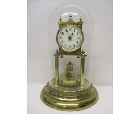 An early 20th century anniversary clock, the white enamel dial having Arabic numerals under a glass dome, the movement inscri