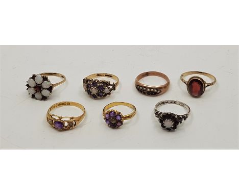 Six various gem stone set gold rings, to include: An 18ct. gold, amethyst and seed pearl ring, assayed Birmingham 1912 (gross