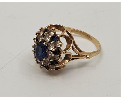 A 9ct. gold, blue and clear stone cluster ring, (gross weight 4.4g)Ring size: UK P