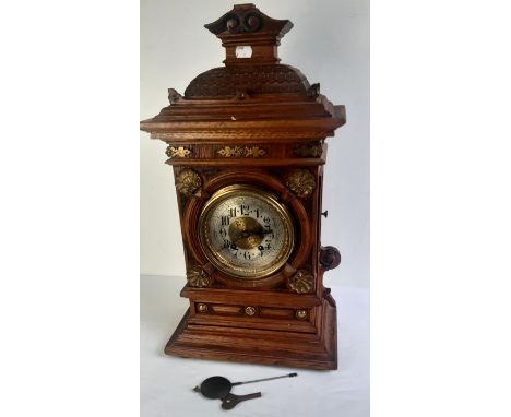 A large Early 20th cent oak cased mantle clock