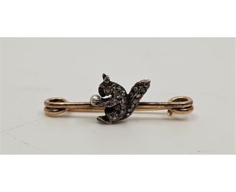 An antique precious metal and diamond set 'squirrel' bar brooch, having realistically fashioned applied yellow and white meta