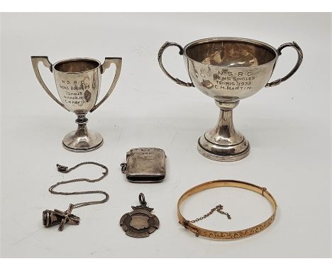 Two silver twin handled trophy cups, both engraved winner N.S.R.C. tennis, mens singles and doubles 1938, together with a sil