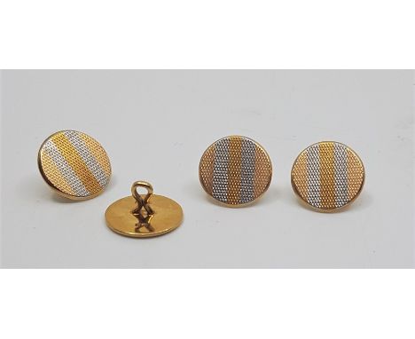 A set of four Edwardian 18ct. yellow gold and platinum engine turned dress shirt buttons, each diameter 14mm, with fittings, 