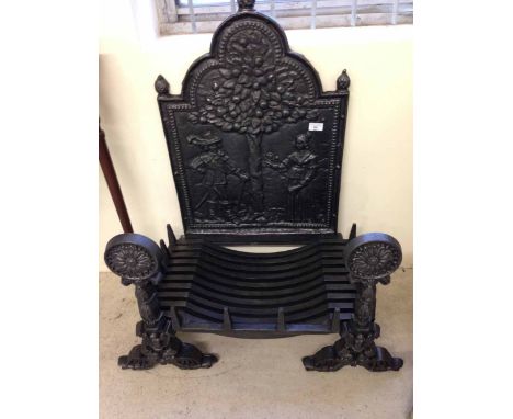 A vintage cast iron fire back, dogs & basket made by Thurton Foundry Norwich with cavalier decoration to back.