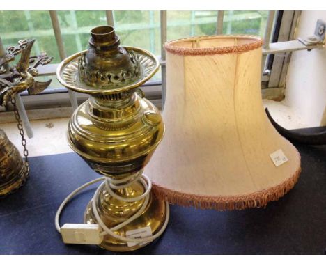 A brass oil lamp & shade converted to electricity.